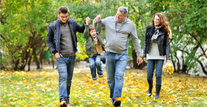 Family walking outdoors in fall